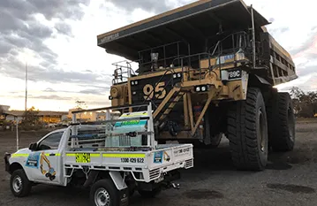 Australian Specialised Machinery Glass team on site with mining dump truck